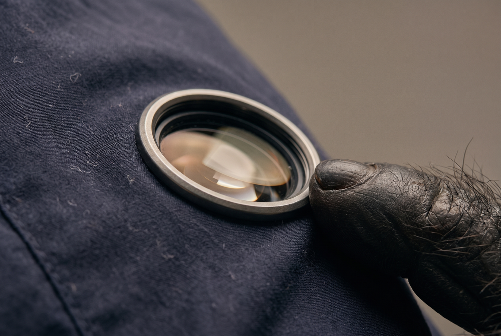 Close up of the lens on the sleeve of a C.P. Company overshirt