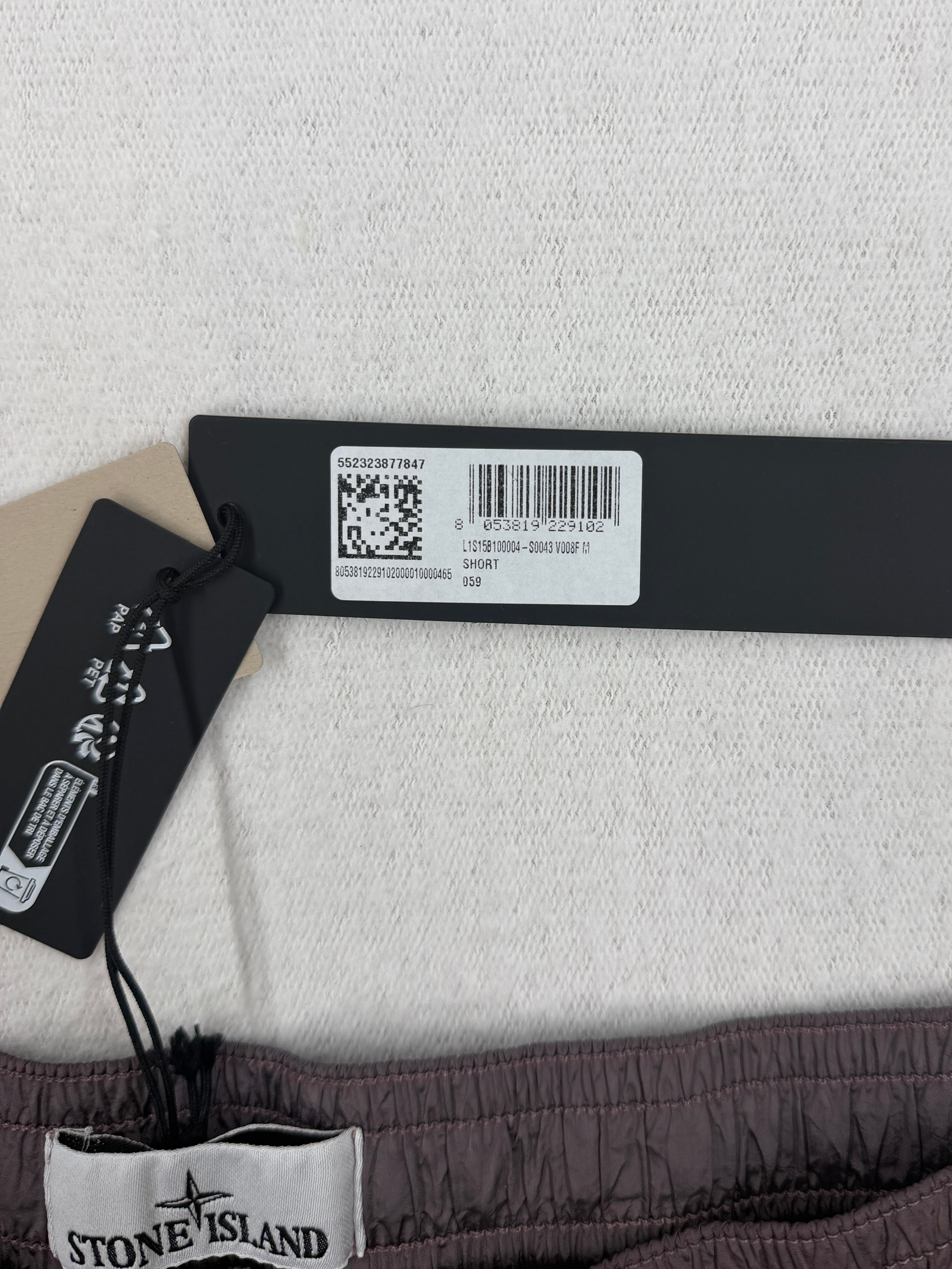 Stone Island ECONYL Regenerated Nylon Swim Shorts — tag