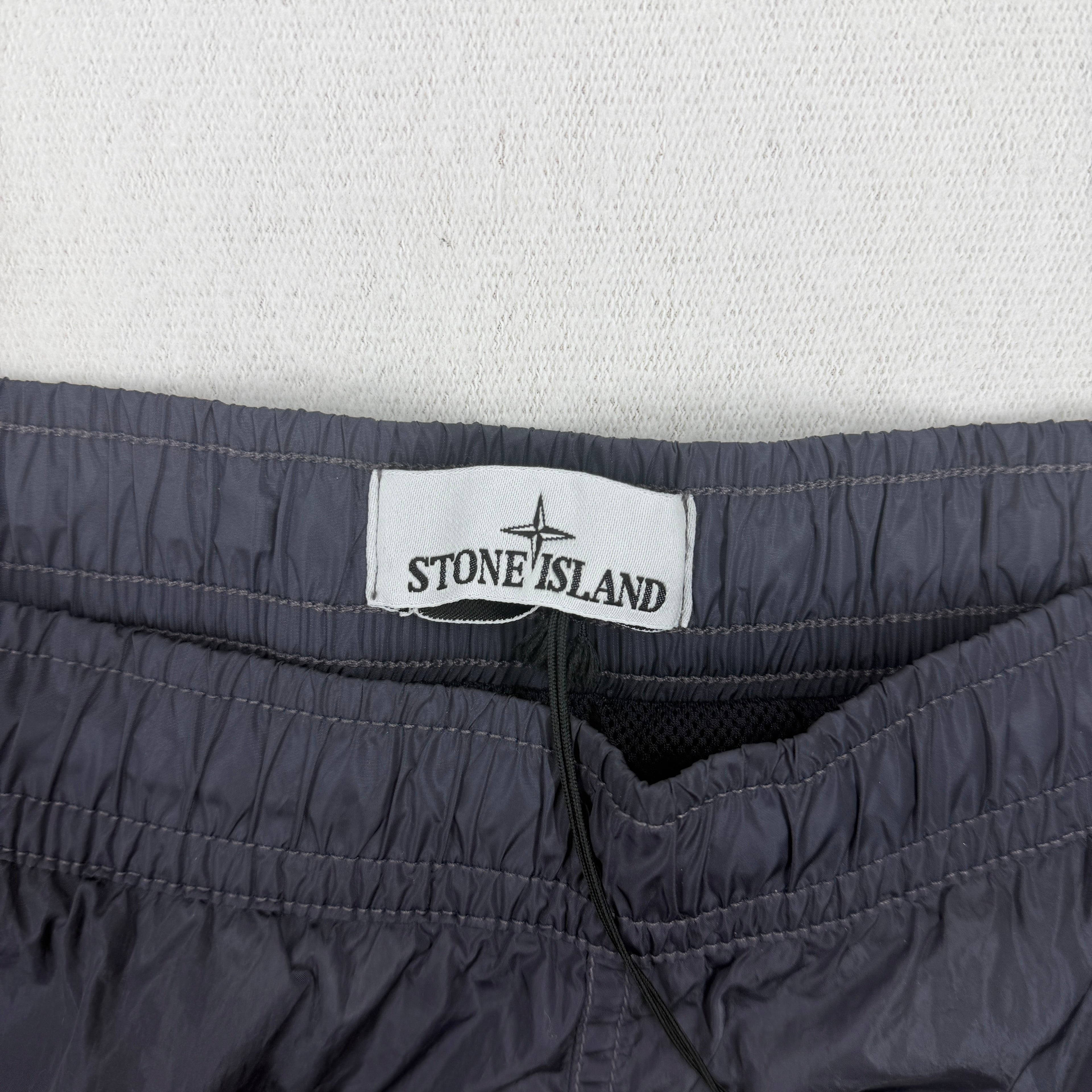 Stone Island Water Reactive Faded Camo Swim Shorts — label
