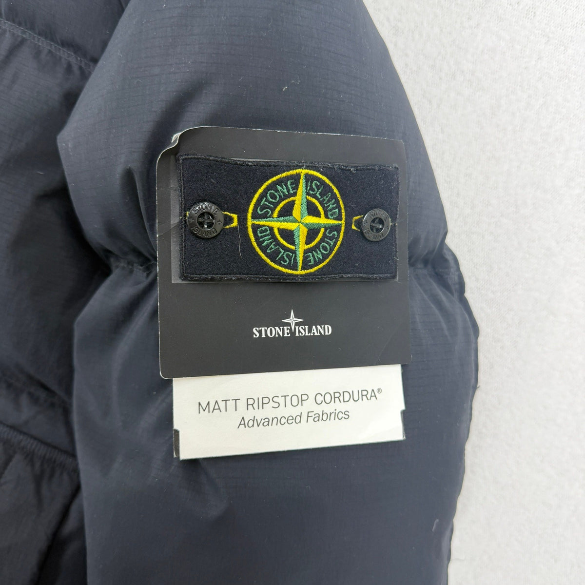 Stone Island AW25 Matt Ripstop Cordura Down Jacket — badge