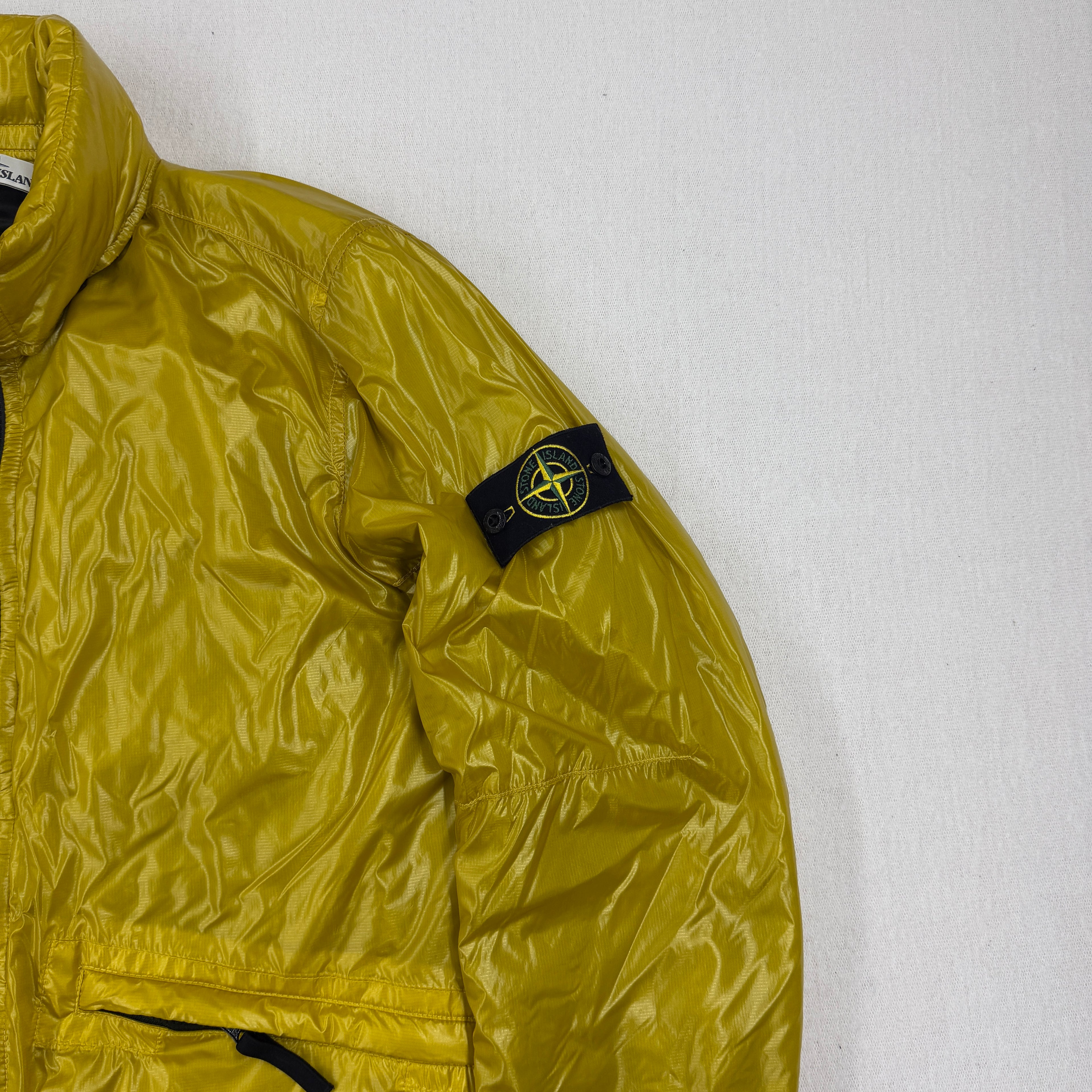Stone Island compass badge — left sleeve